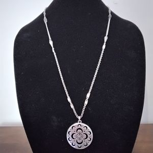Lucky Brand silvertone necklace with cut out design medallion
